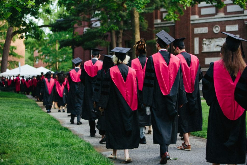 Graduates walk through Harvard Yard during Commencement