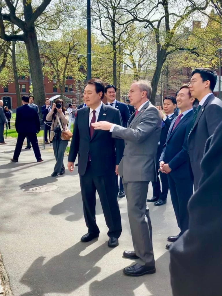 President of the Republic of Korea Yoon Suk Yeol (left) stands with Harvard Vice Provost for International Affairs Mark Elliott (right) in Harvard Yard.